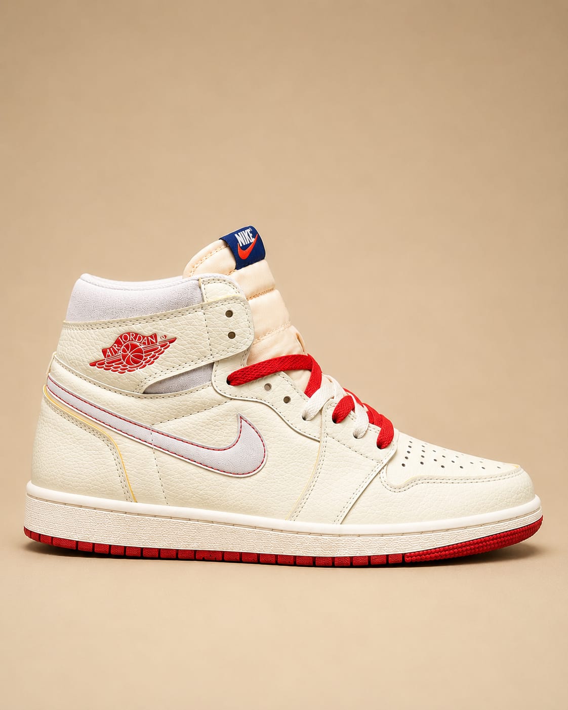 Side profile view of Air Jordan 1 Retro High OG Rare Air Sail sneaker in Sail, Neutral Grey, Deep Royal Blue and Gym Red